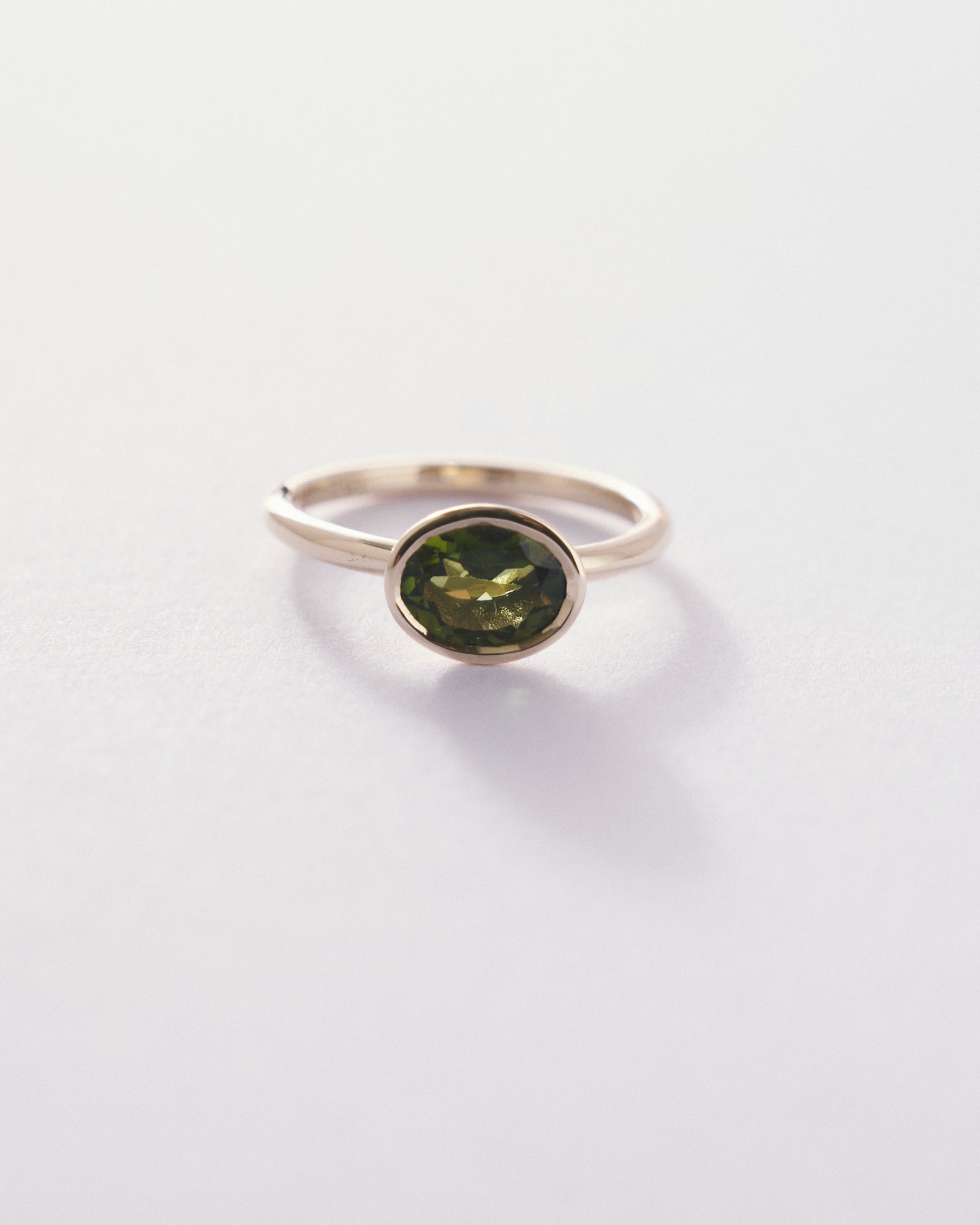 Cupped Bezel oval cut tourmaline solitaire
