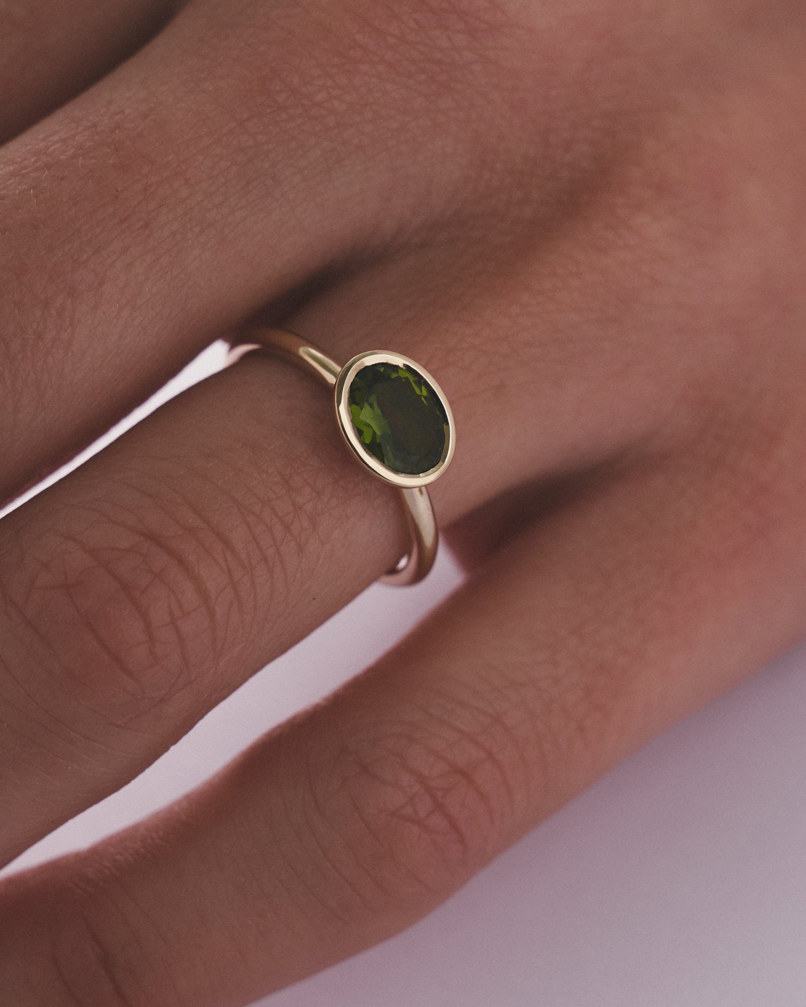 Cupped Bezel oval cut tourmaline solitaire