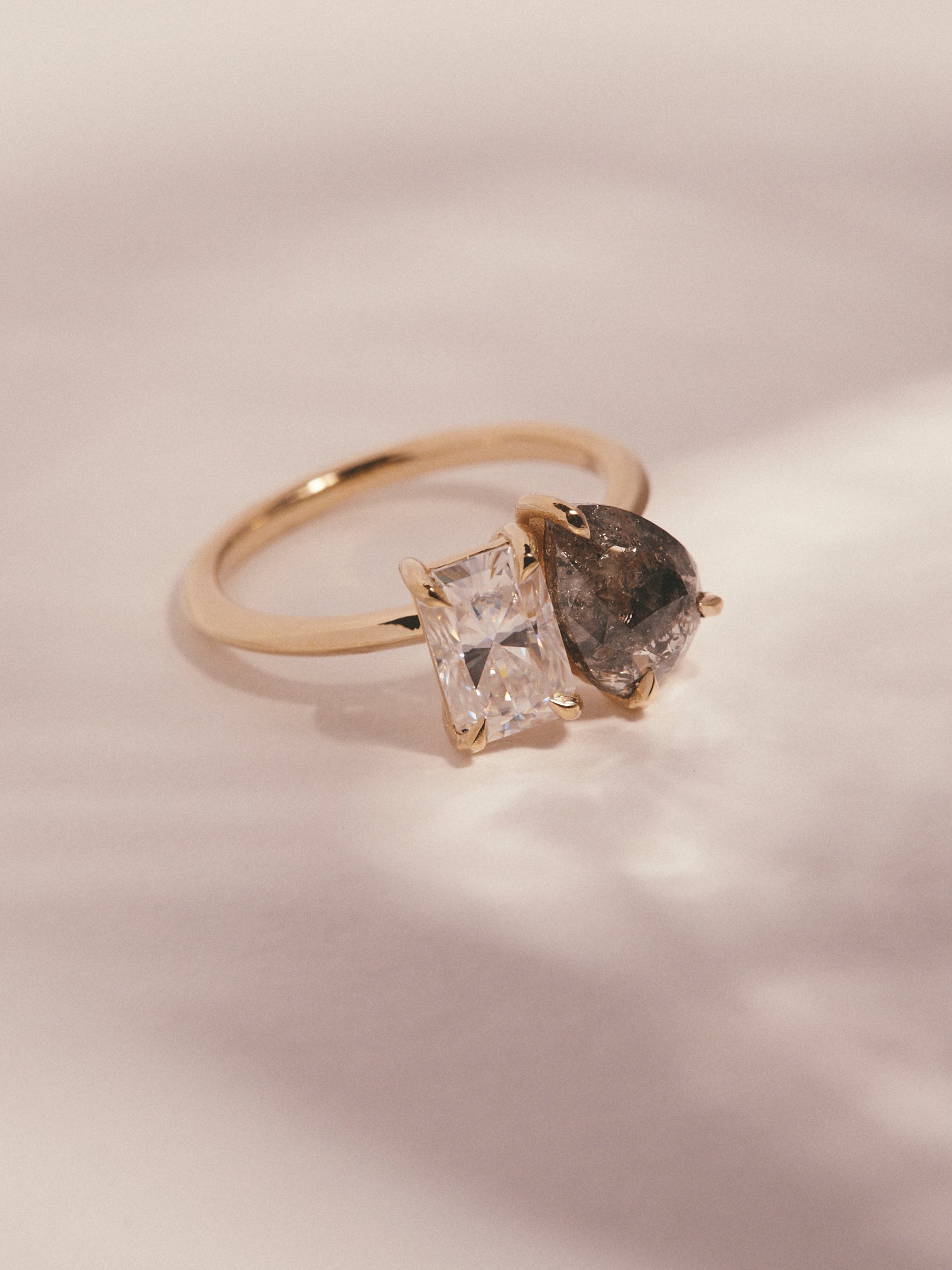 1.223ct pear cut salt and pepper diamond and 1.20ct radiant cut moissanite engagement ring.