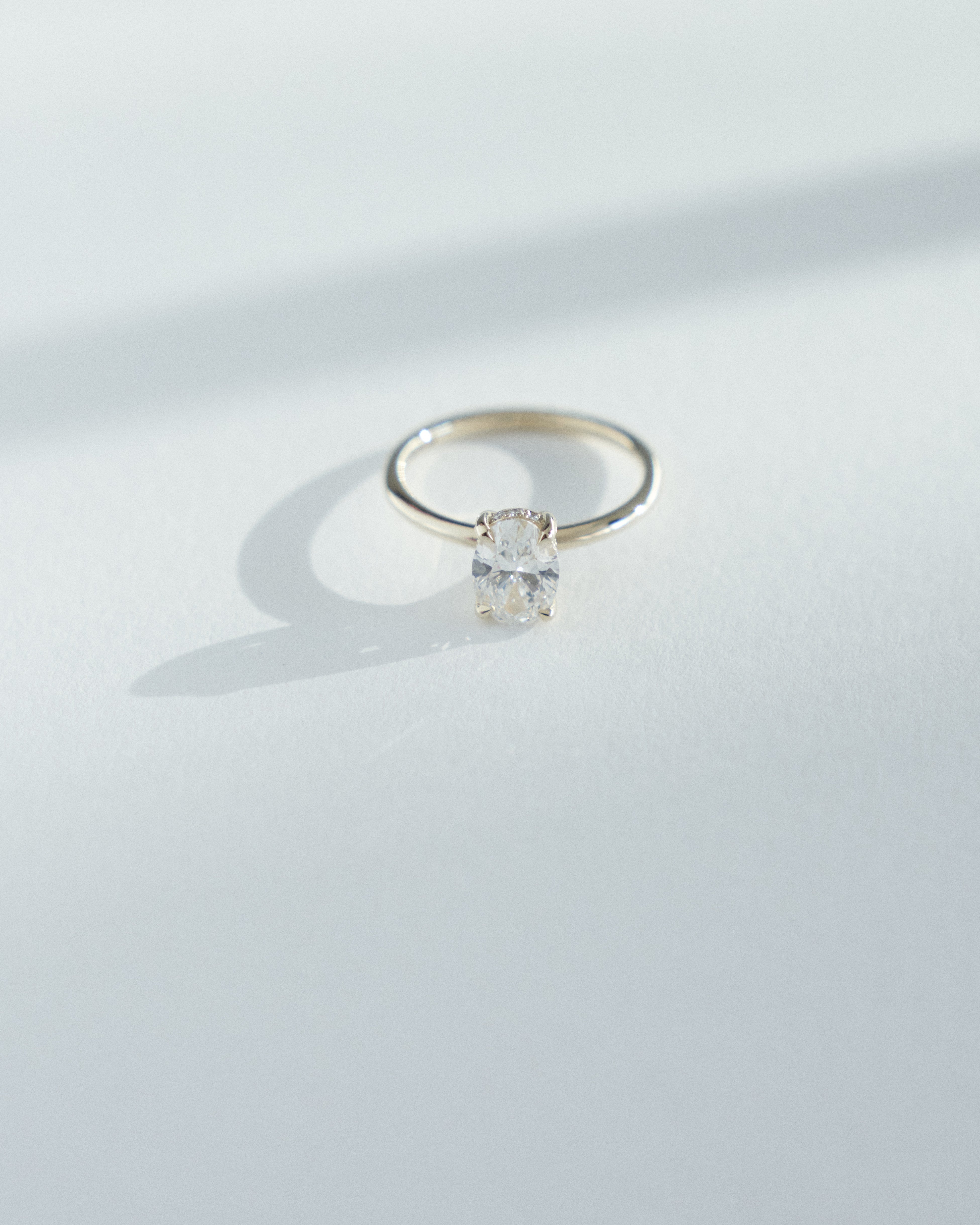 0.90ct Oval diamond solitaire with 0.005ct hidden halo.