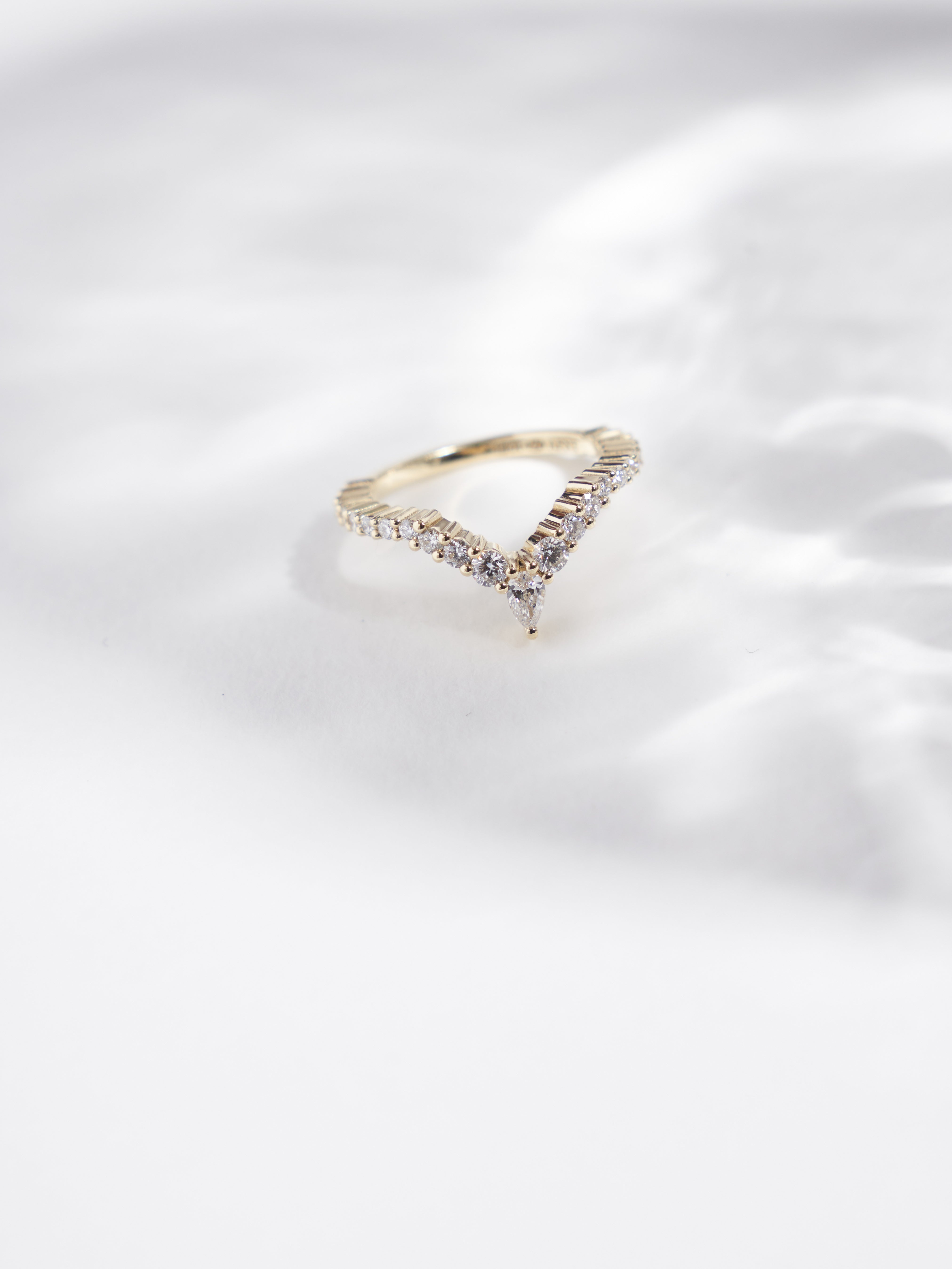 Pear and round cut lab grown diamond wedding band.