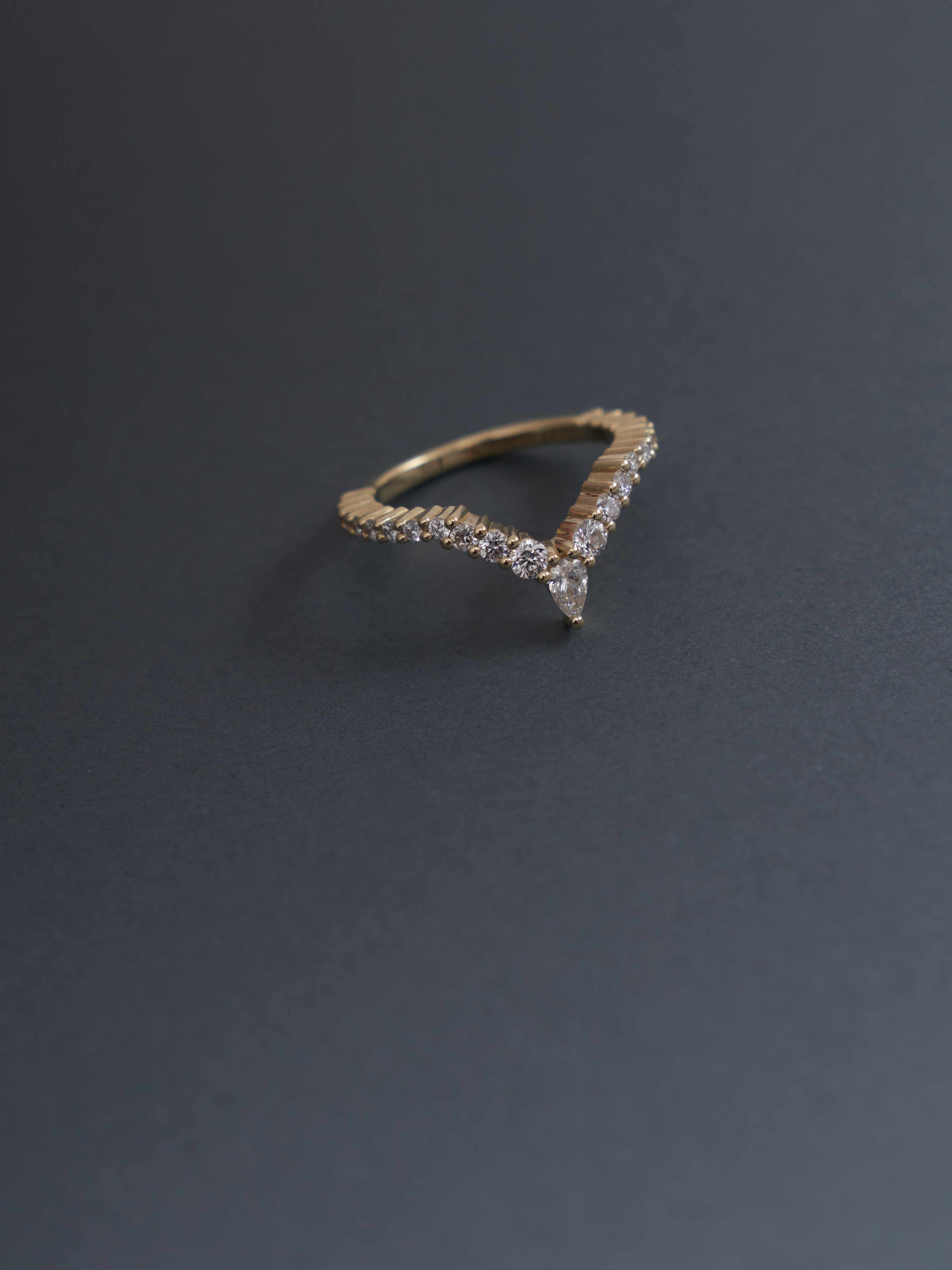 Pear and round cut lab grown diamond wedding band.