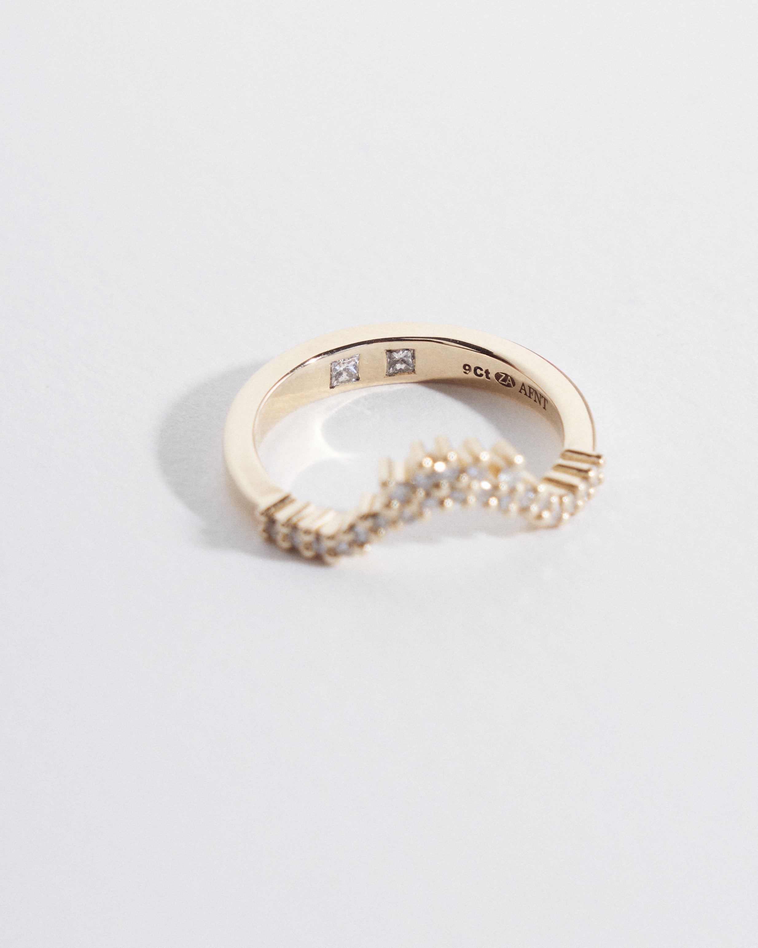 Asymmetrical fitted wedding band