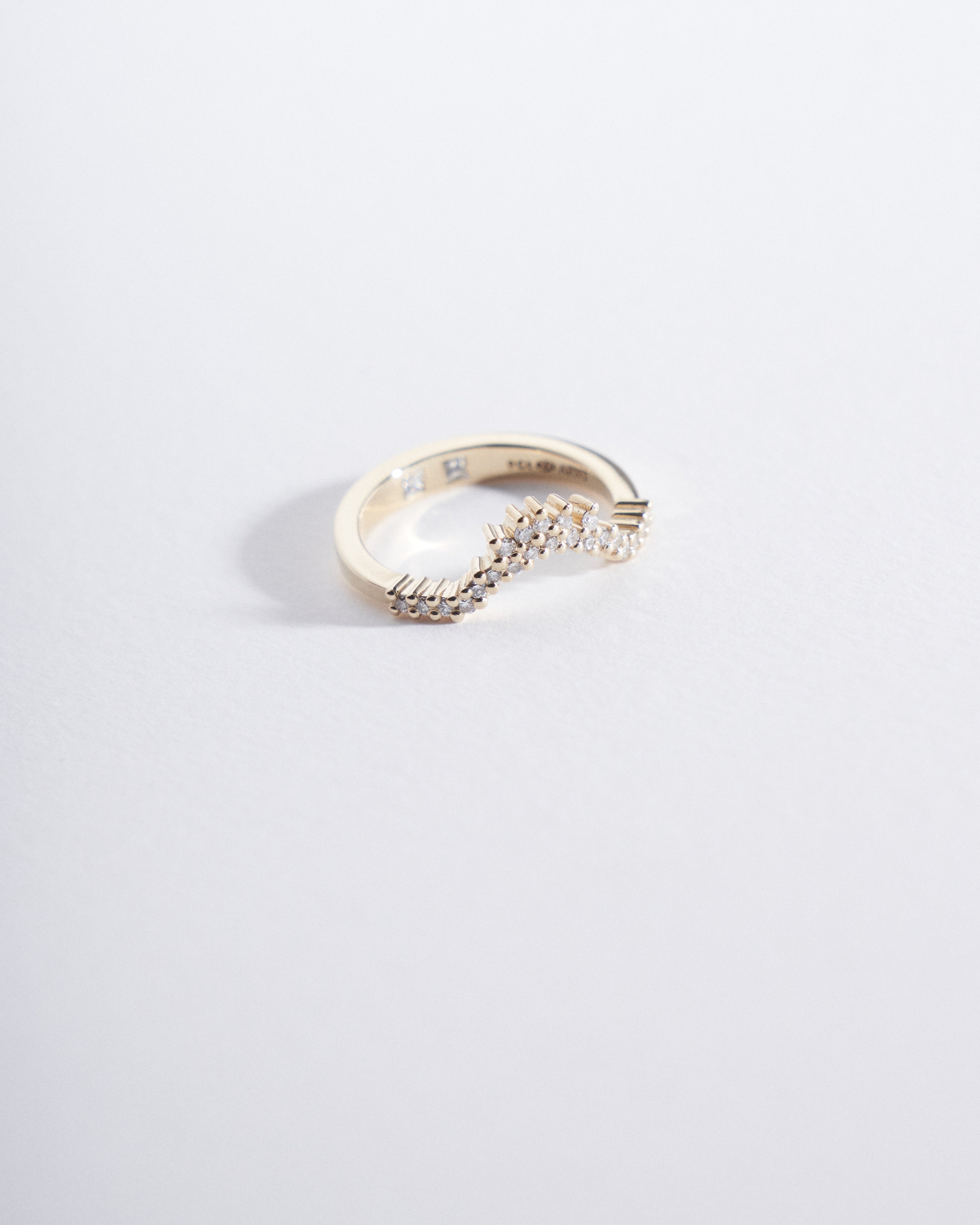 Asymmetrical fitted wedding band