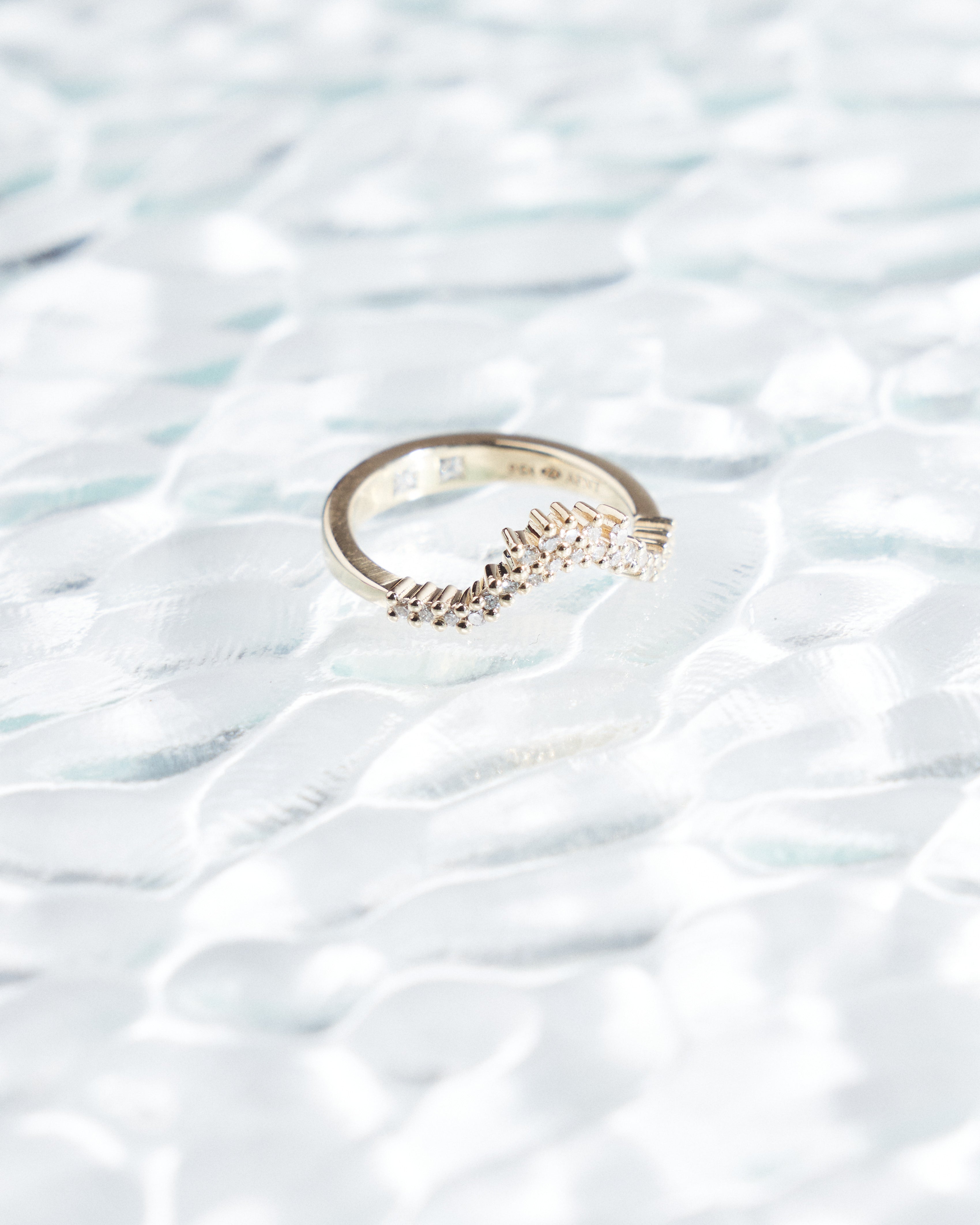 Asymmetrical fitted wedding band