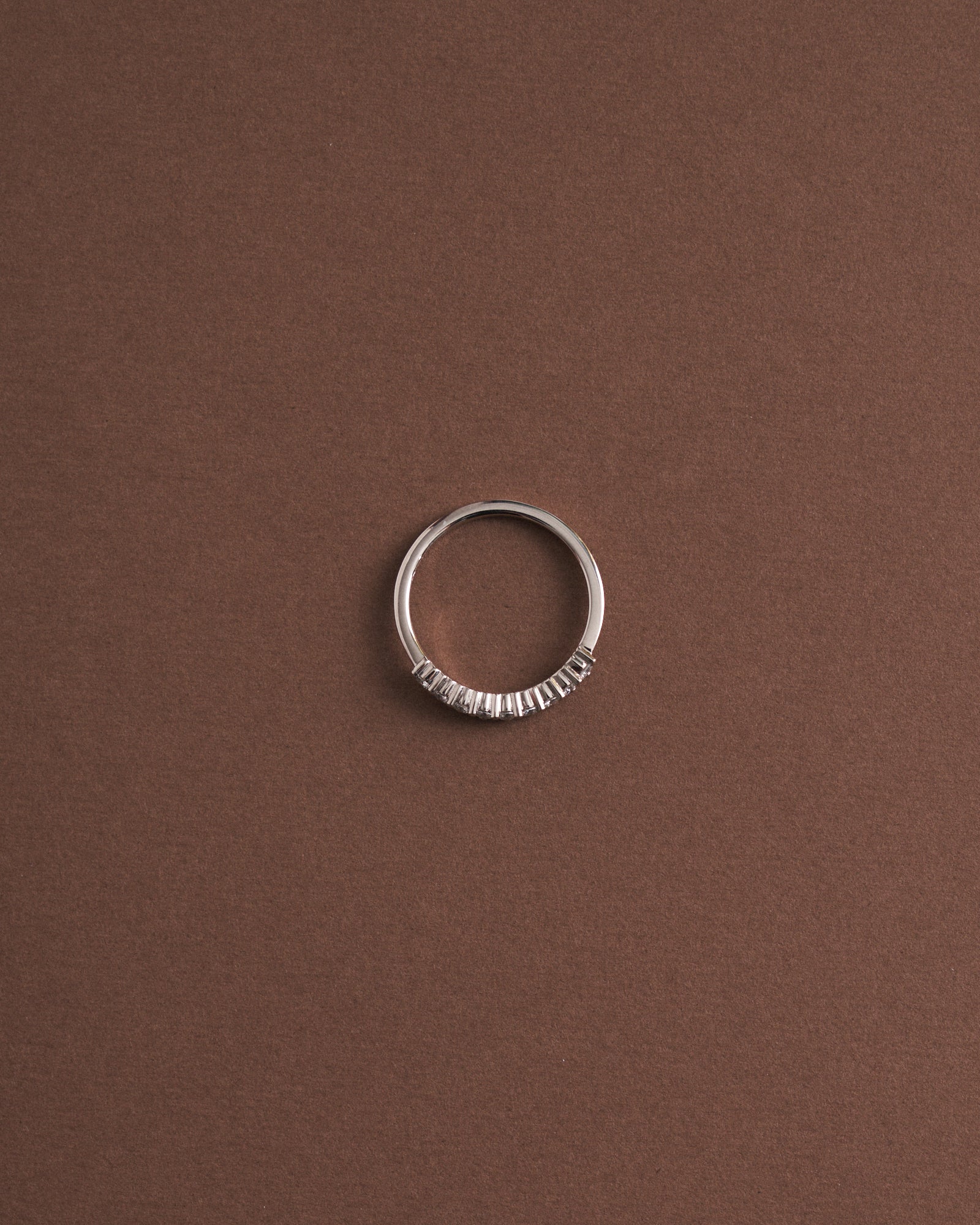 0.03ct curved diamond wedding band.