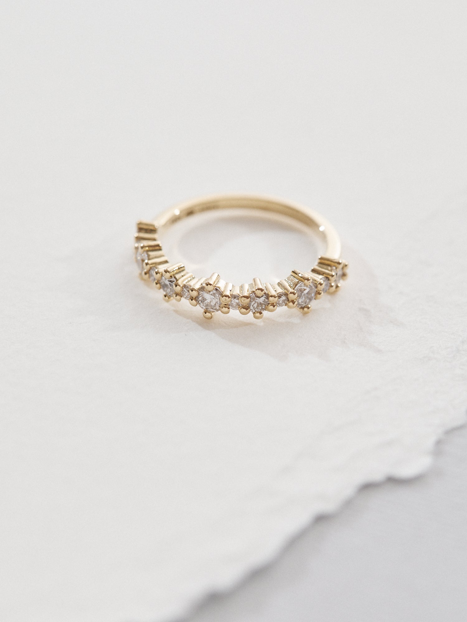 Celestial half eternity wedding band with alternating diamonds.