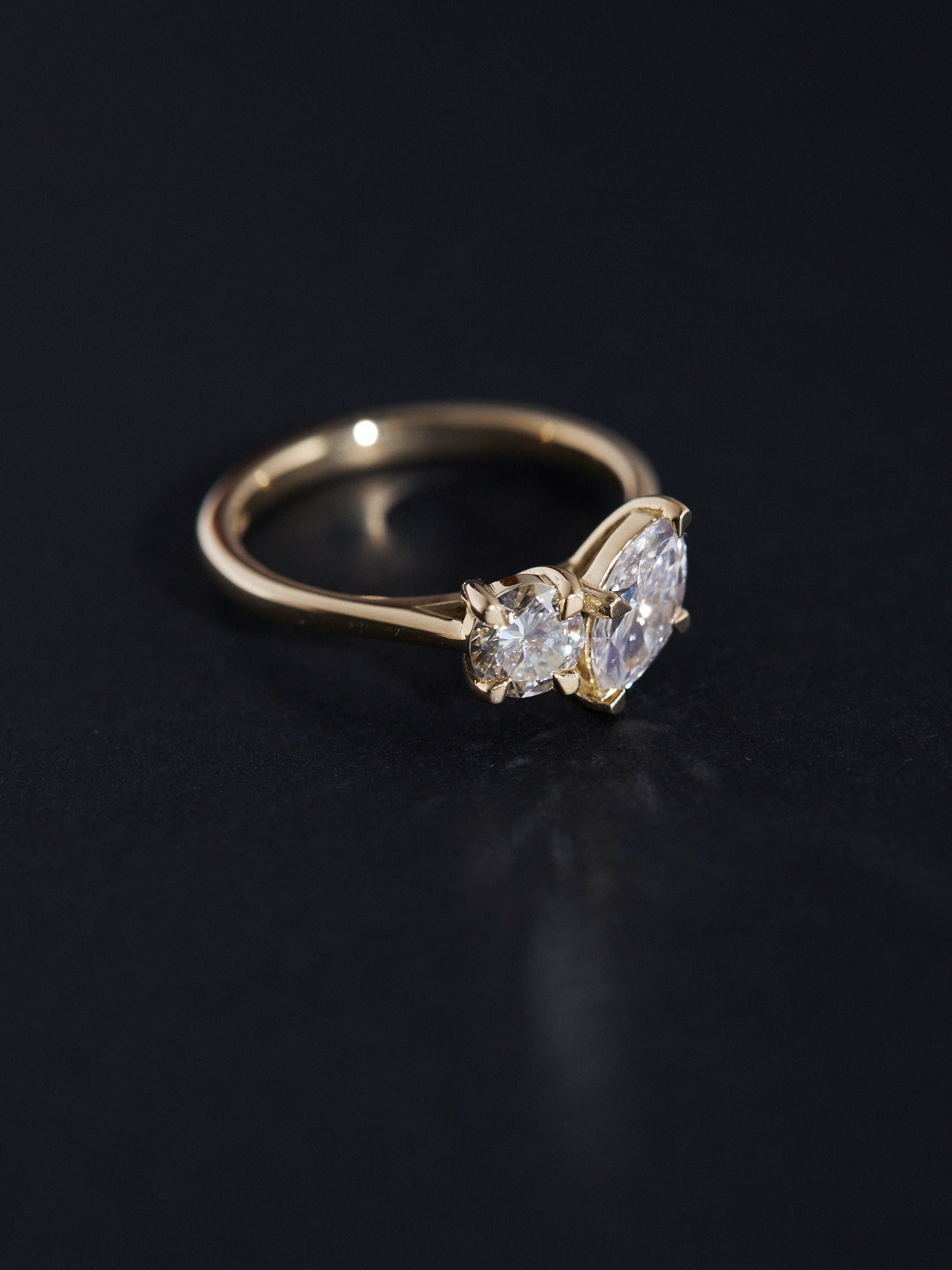 0.50ct Marquise and 0.40ct round cut diamond cathedral engagement ring.