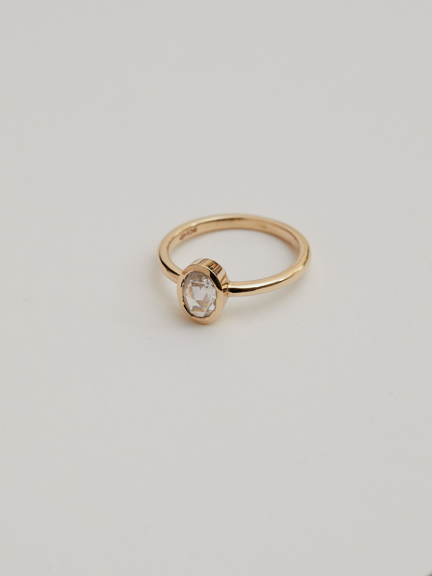 0.617ct Rose cut oval diamond bezel solitaire.