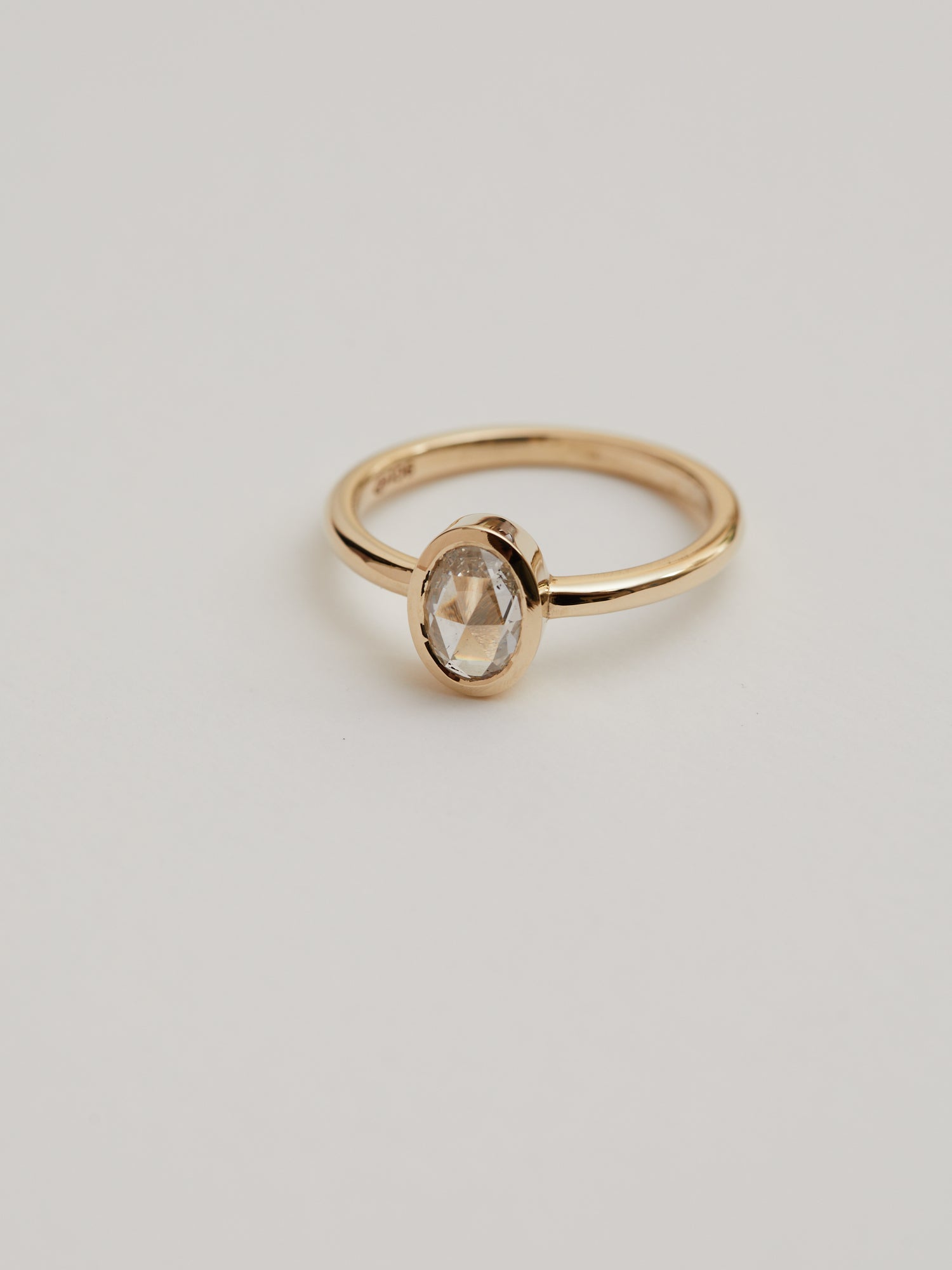 0.617ct Rose cut oval diamond bezel solitaire.