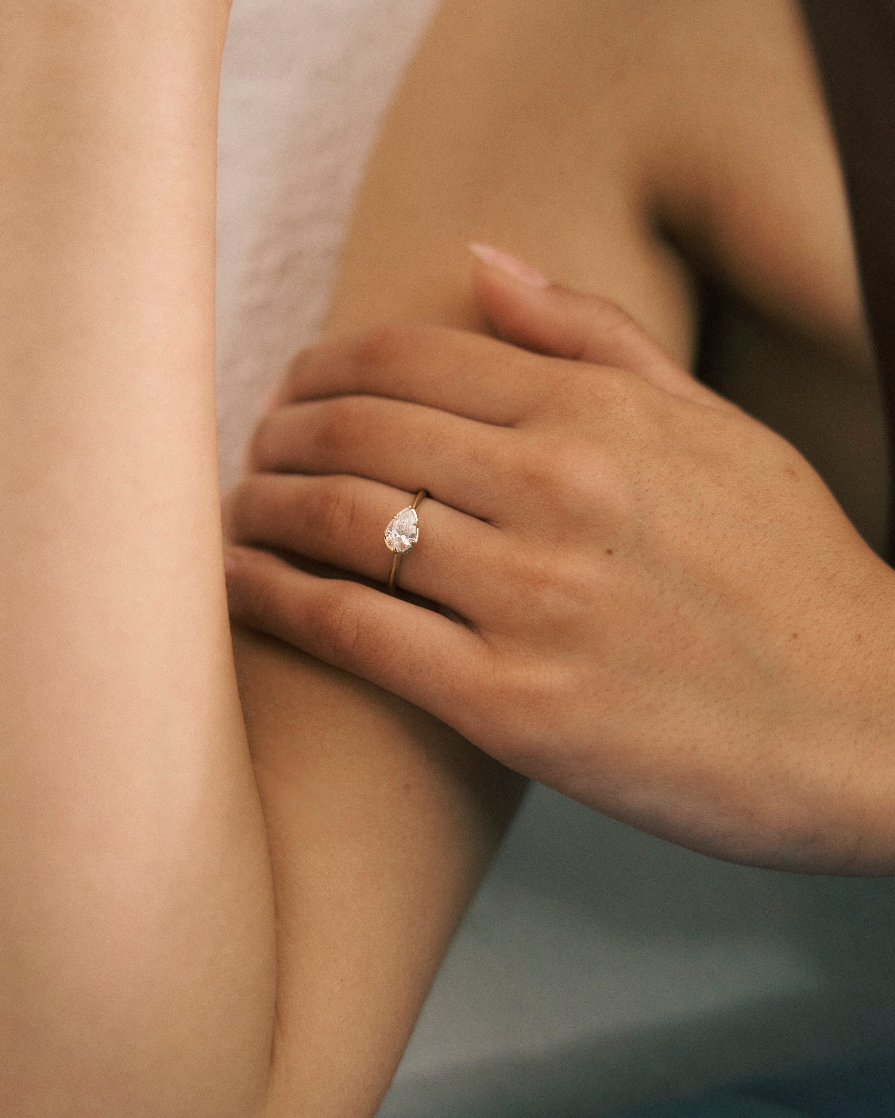 Pear Cut East-West Six Claw Engagement Ring