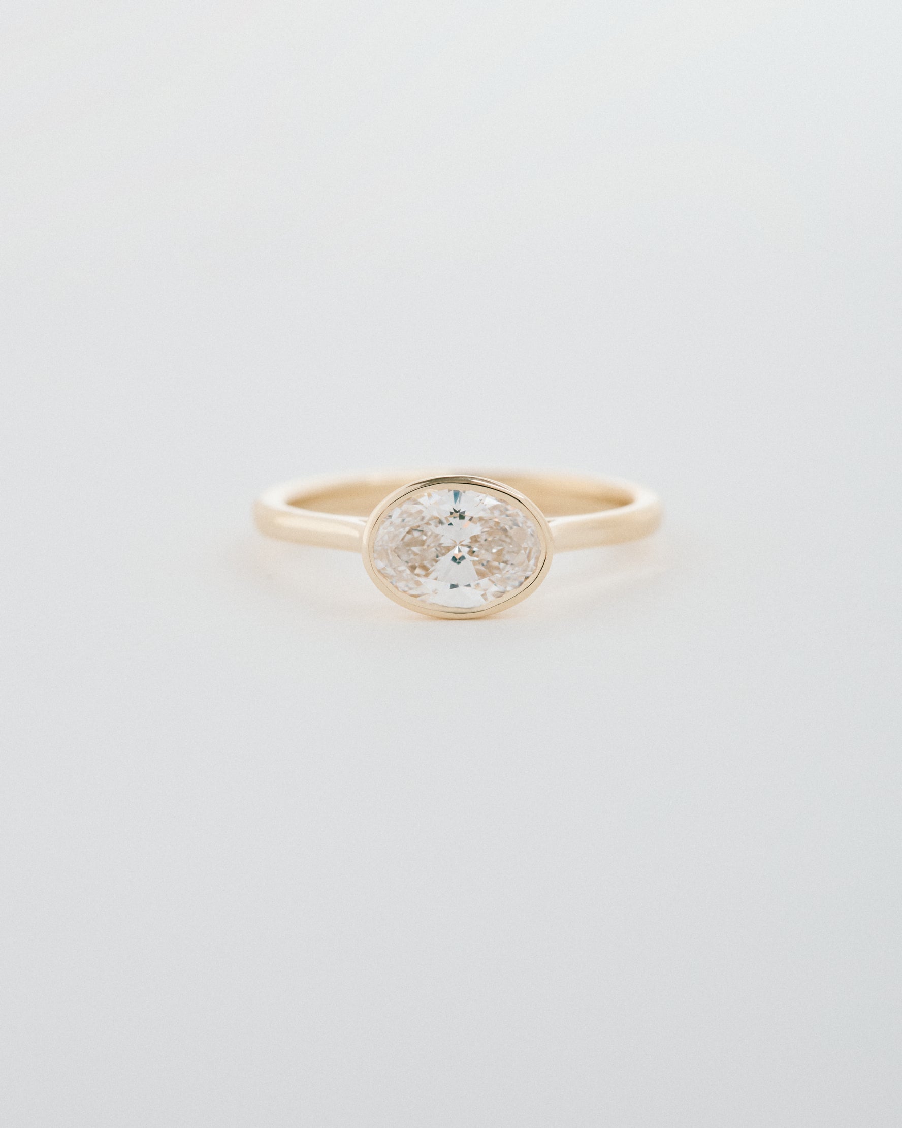 Oval Cut East-West Bezel Engagement Ring