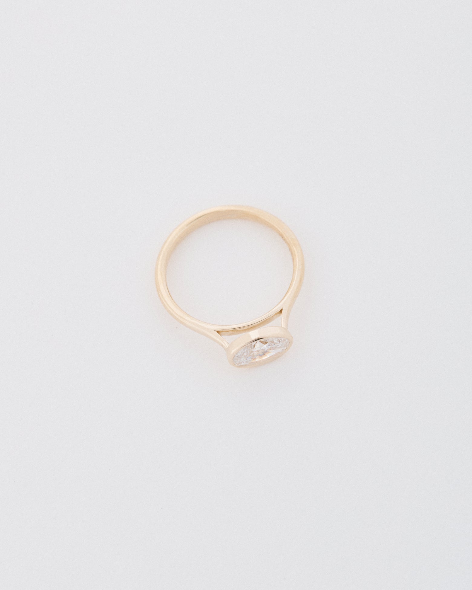 Oval Cut East-West Bezel Engagement Ring