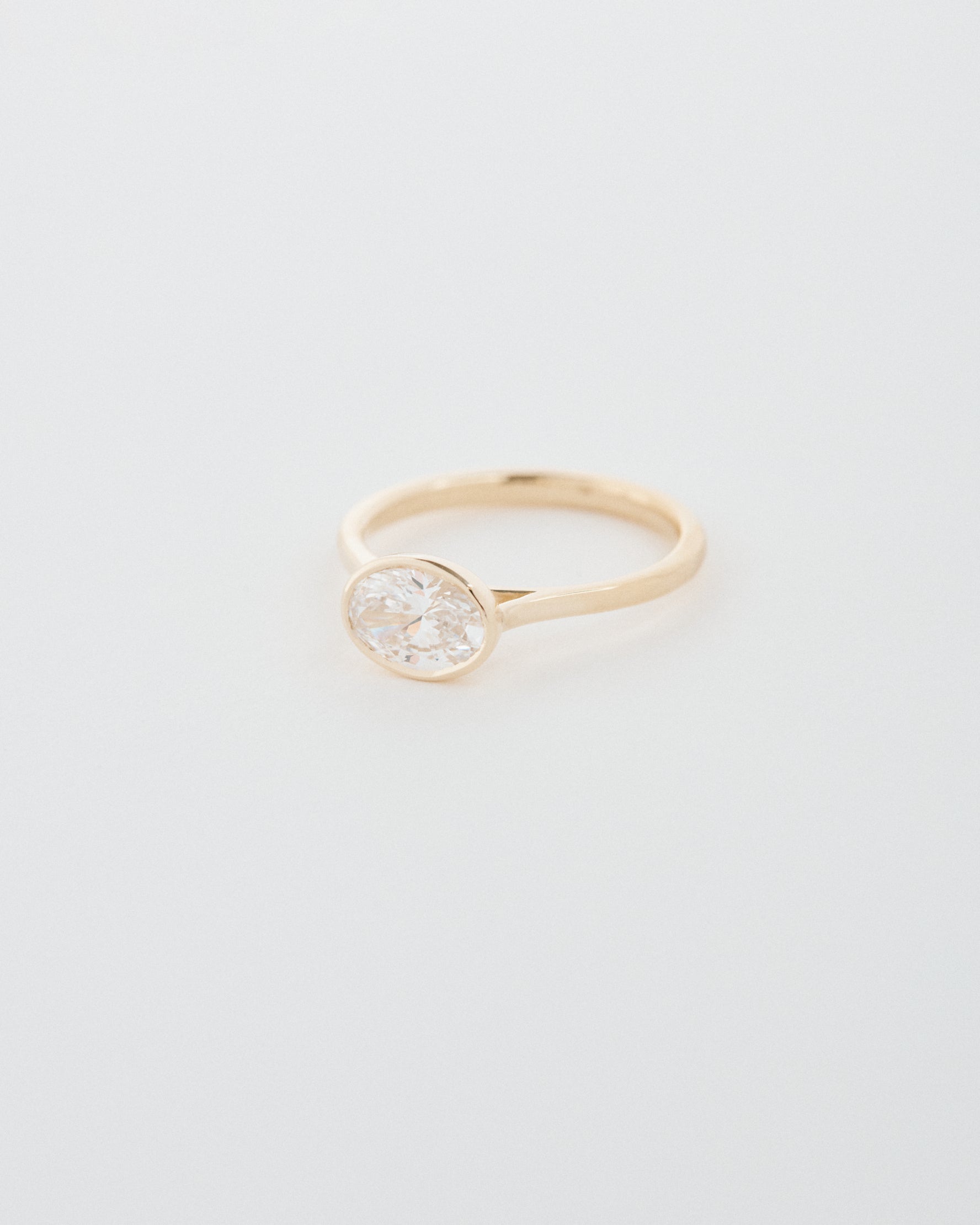Oval Cut East-West Bezel Engagement Ring