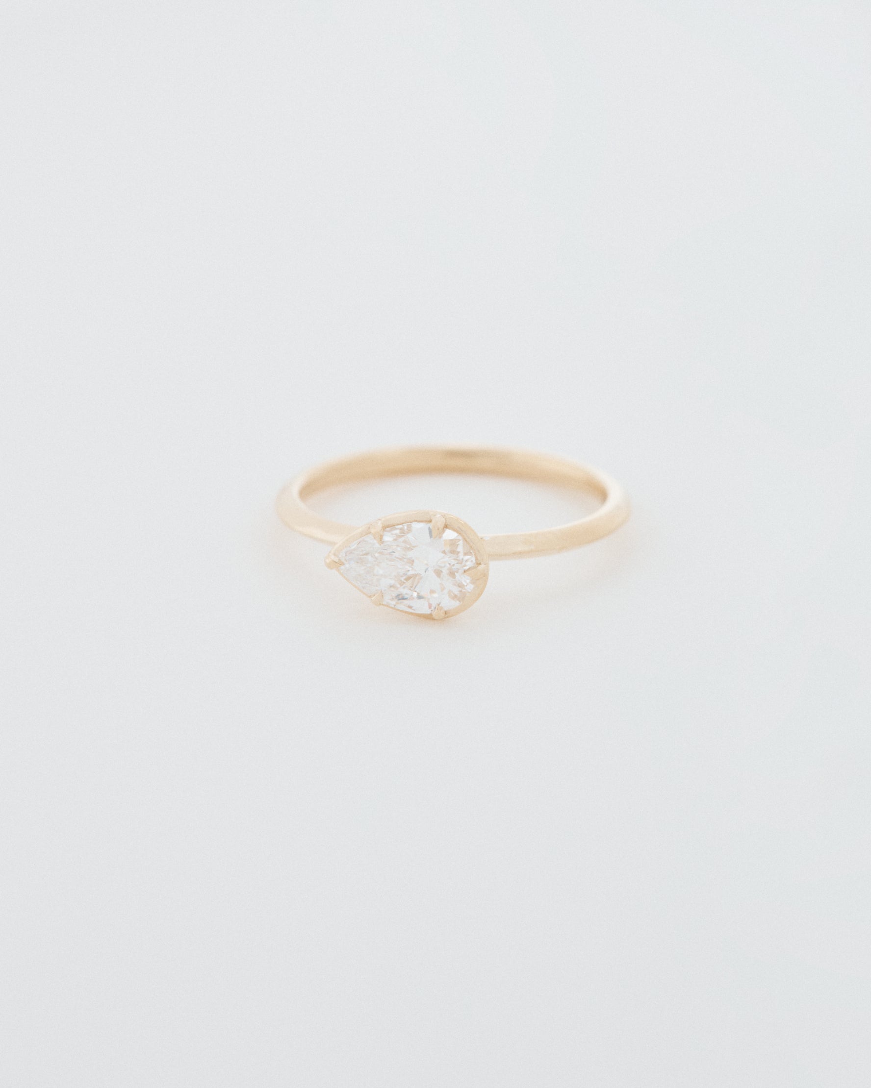Pear Cut East-West Six Claw Engagement Ring