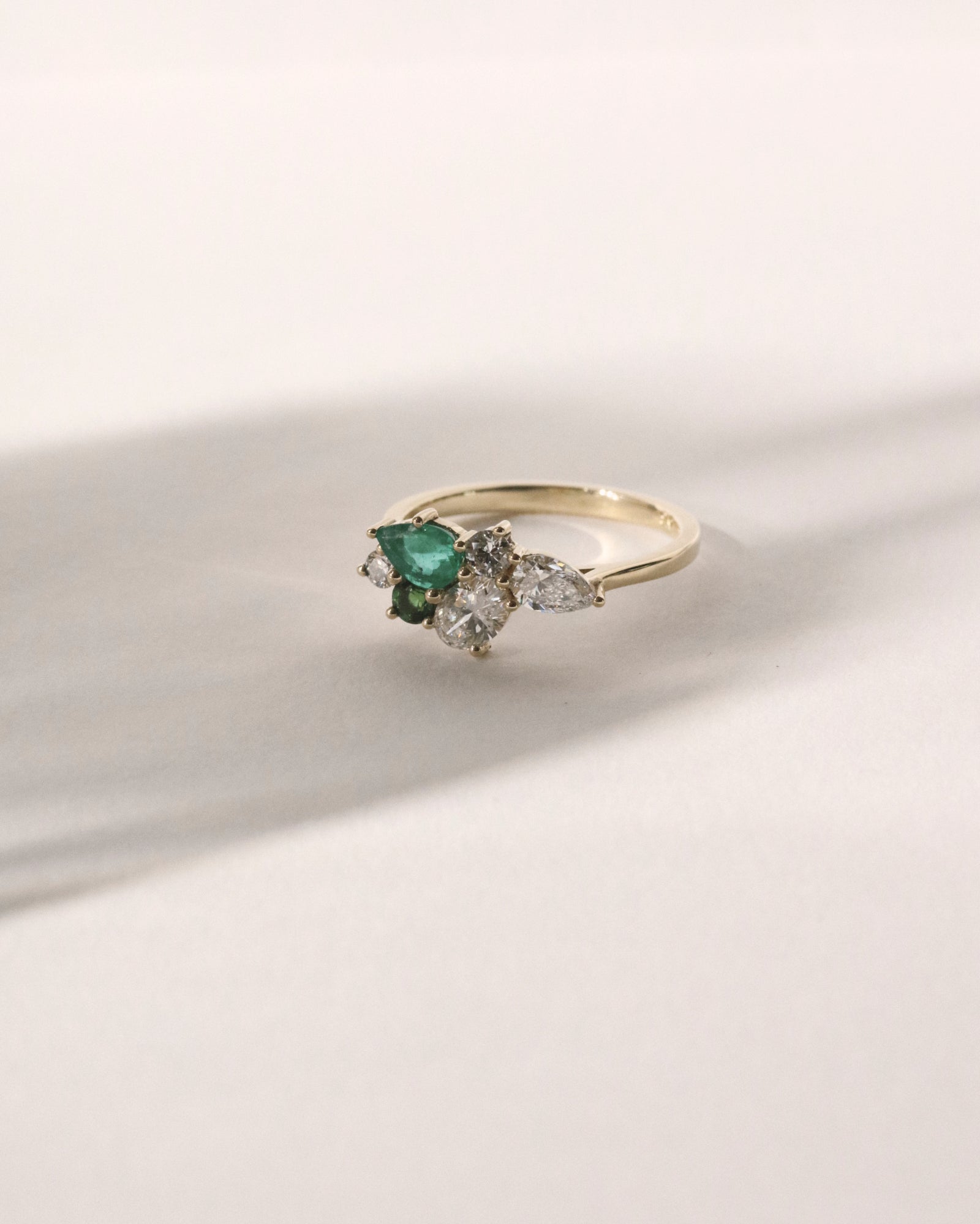 Emerald, tourmaline and diamond cluster.