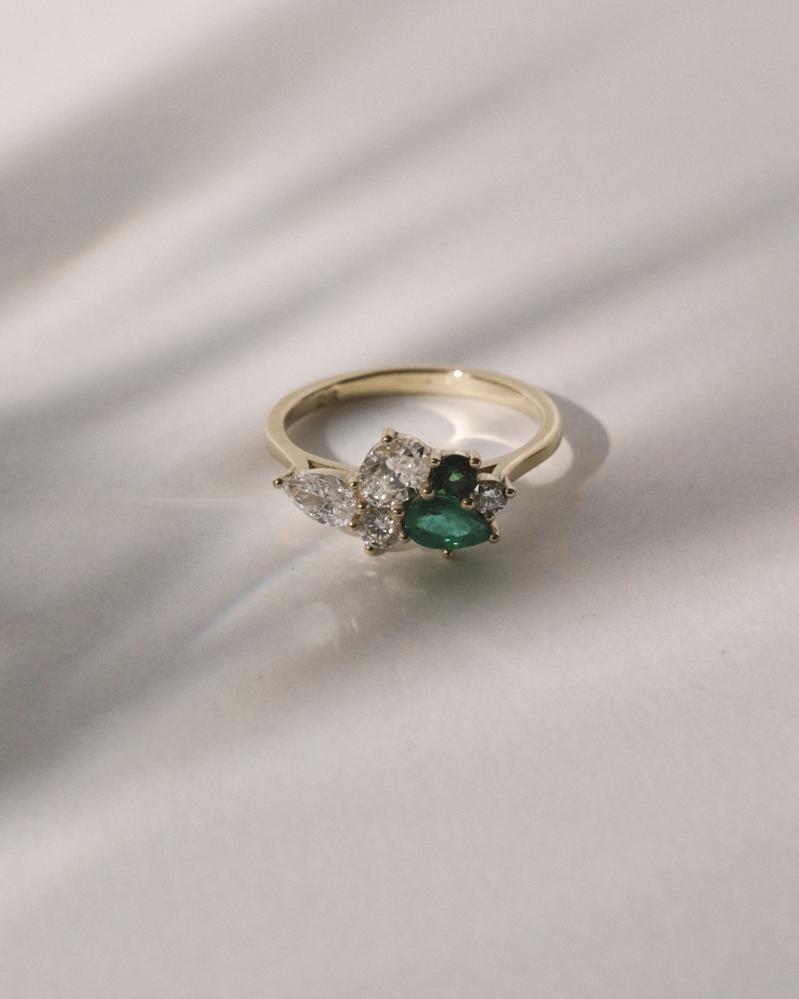 Emerald, tourmaline and diamond cluster.