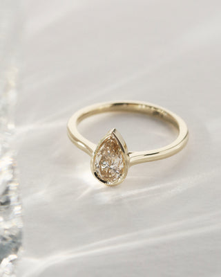 0.58ct pear cut champagne diamond solitaire