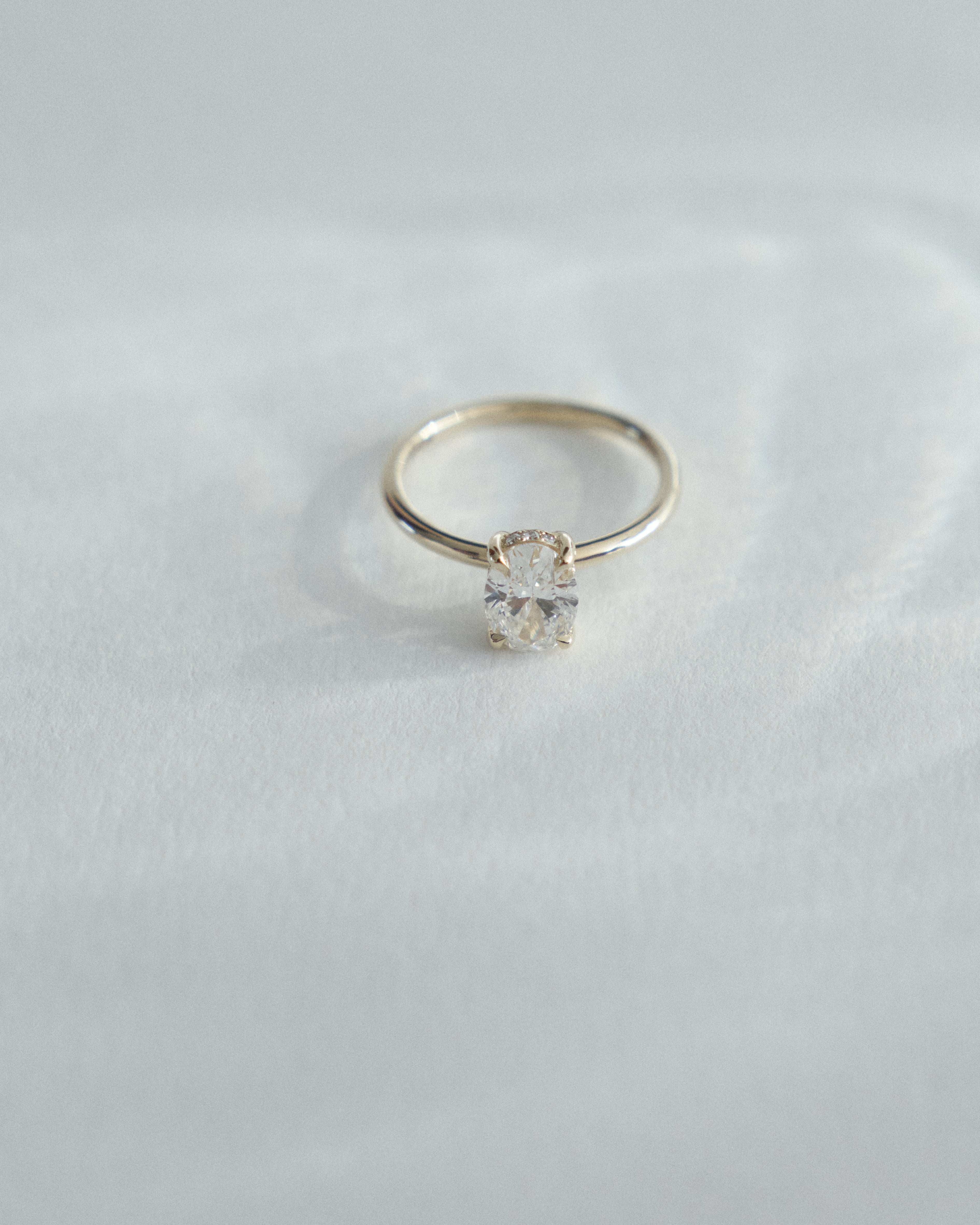 0.90ct Oval diamond solitaire with 0.005ct hidden halo.