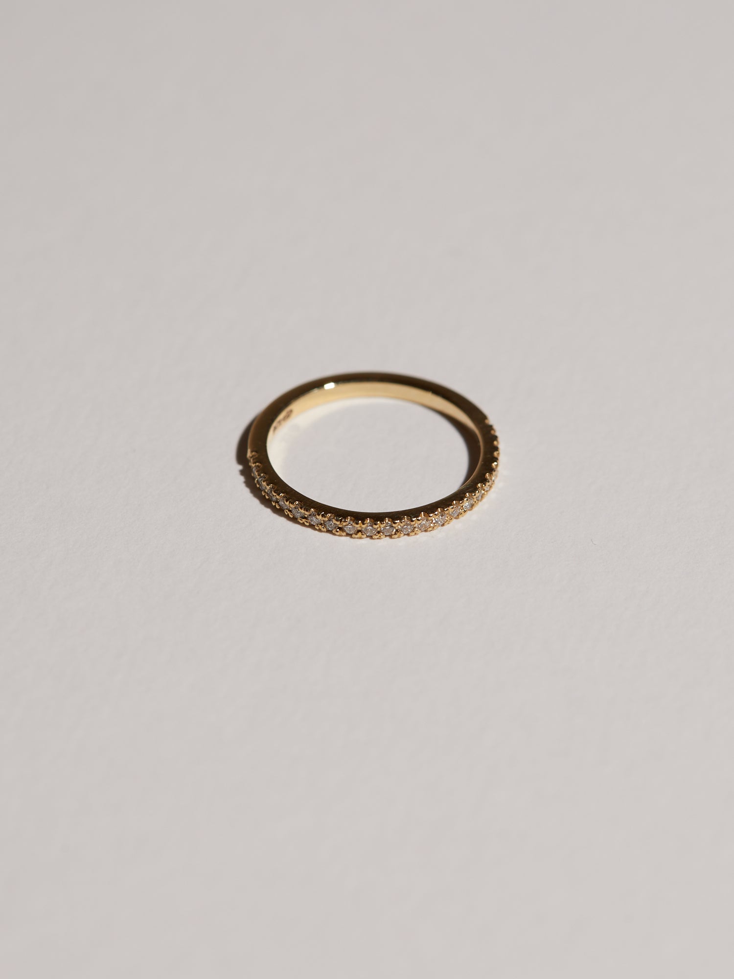Cut-out claw pavé half eternity