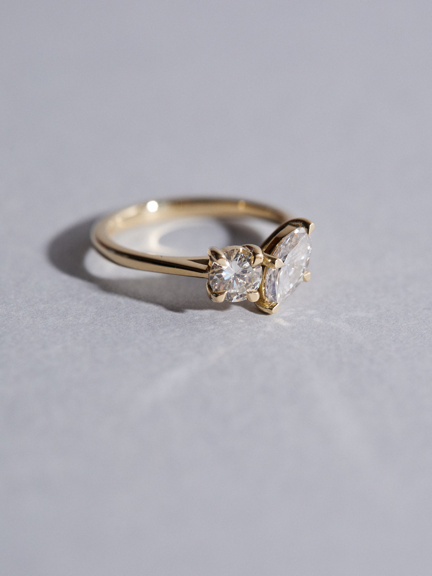 0.50ct Marquise and 0.40ct round cut diamond engagement ring.