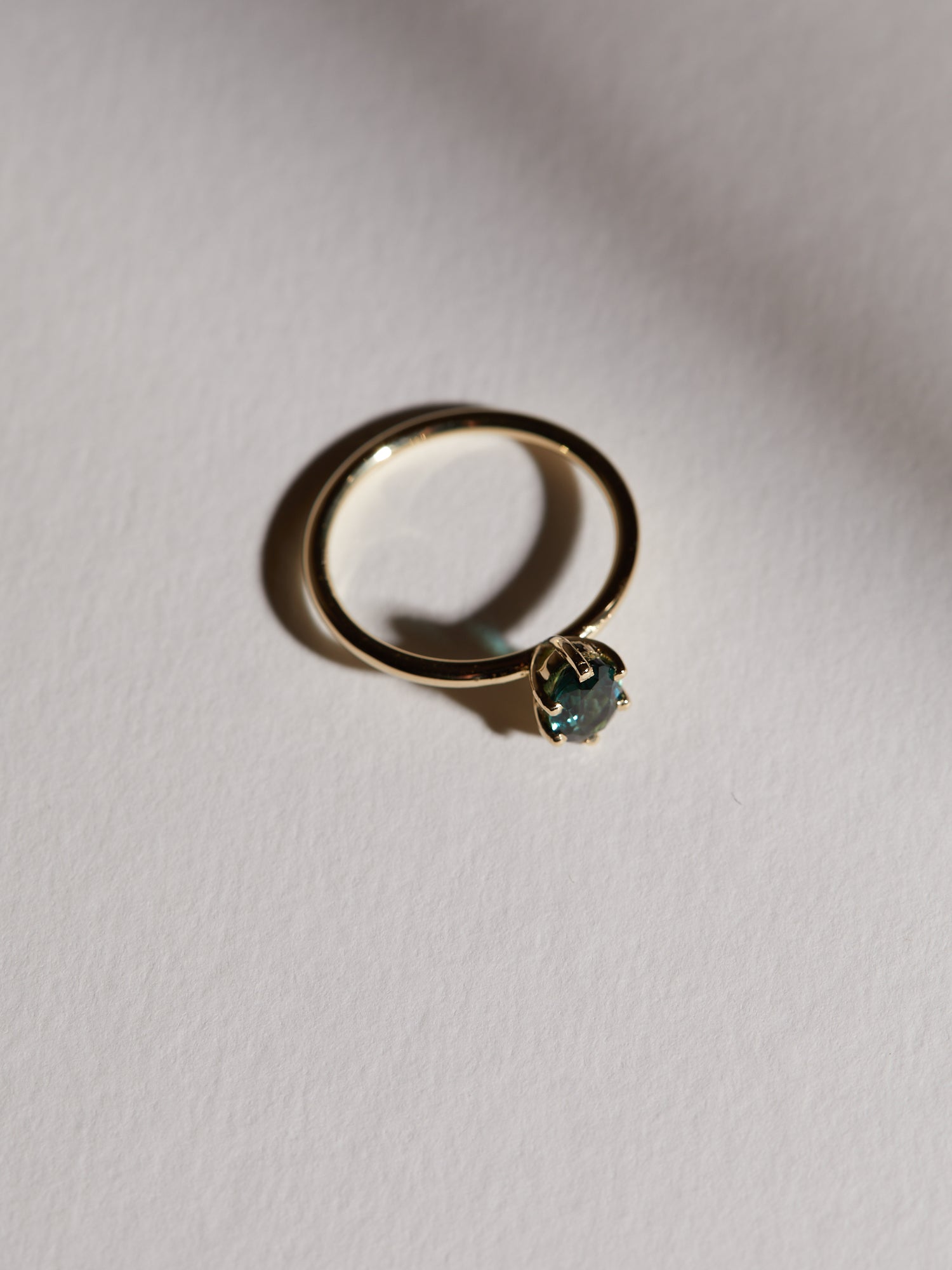 0.83ct Oval teal tourmaline solitaire.